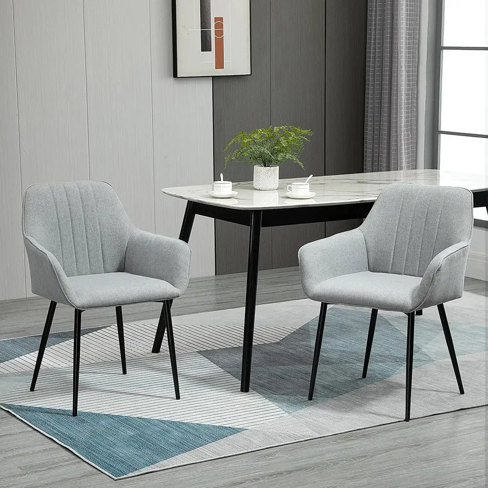 Ensemble de 2 chaises, pieds fins en métal noir, assise, dossier et accoudoirs ergonomiques, tissu en lin gris.
